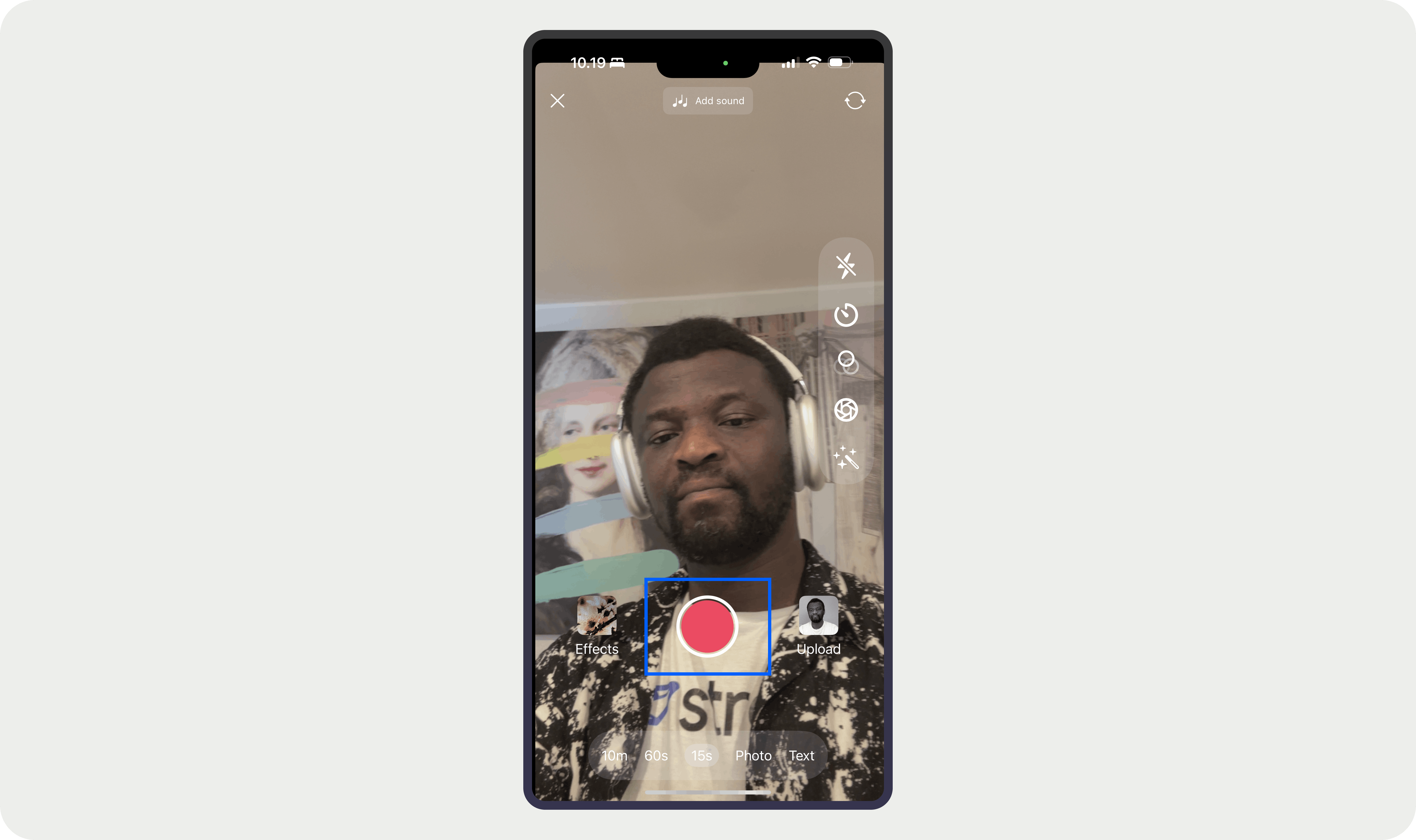 A video recording button overlaid on image of a man wearing an earphone